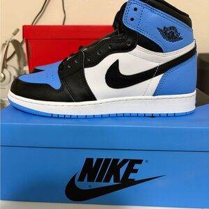 Nike Air Jordan High Tops in Black, White, and Blue